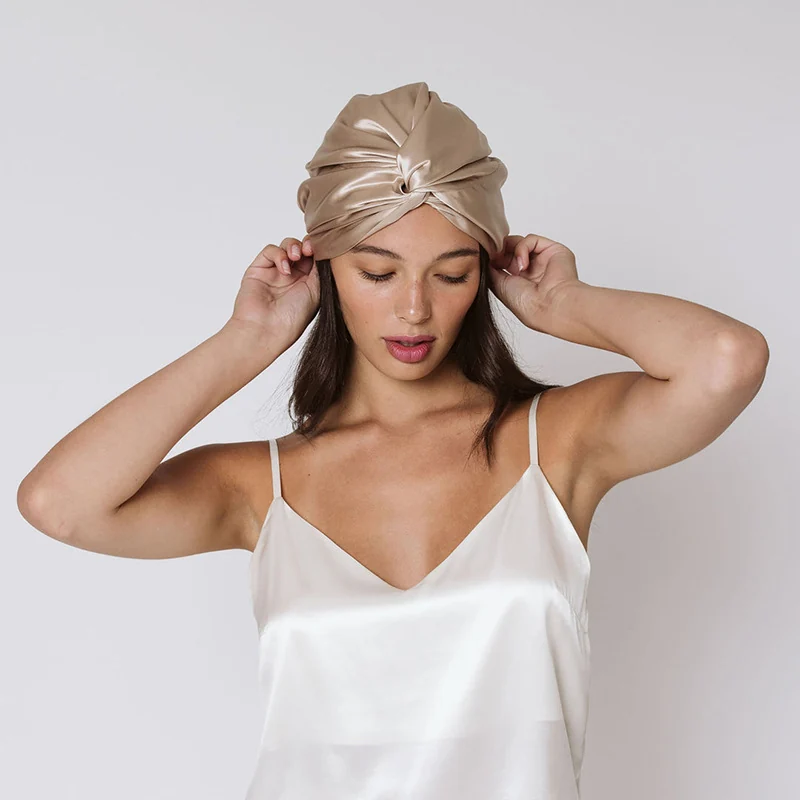 Model wearing a mulberry silk bonnet; colour shown may differ